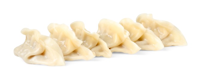 Photo of Tasty boiled gyoza (dumplings) isolated on white