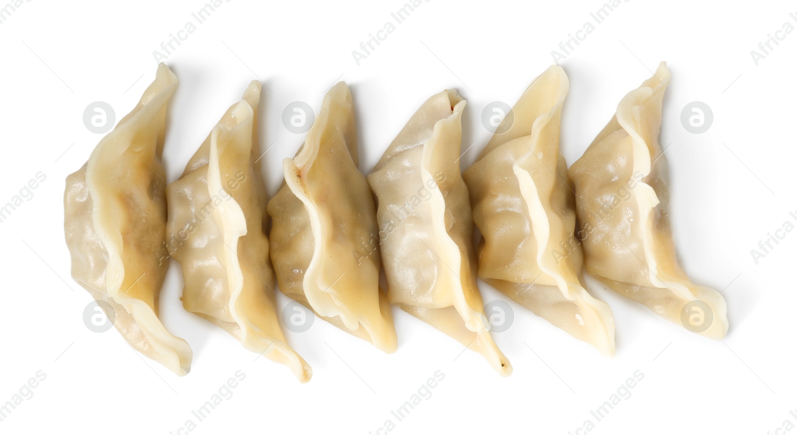 Photo of Tasty boiled gyoza (dumplings) isolated on white, top view