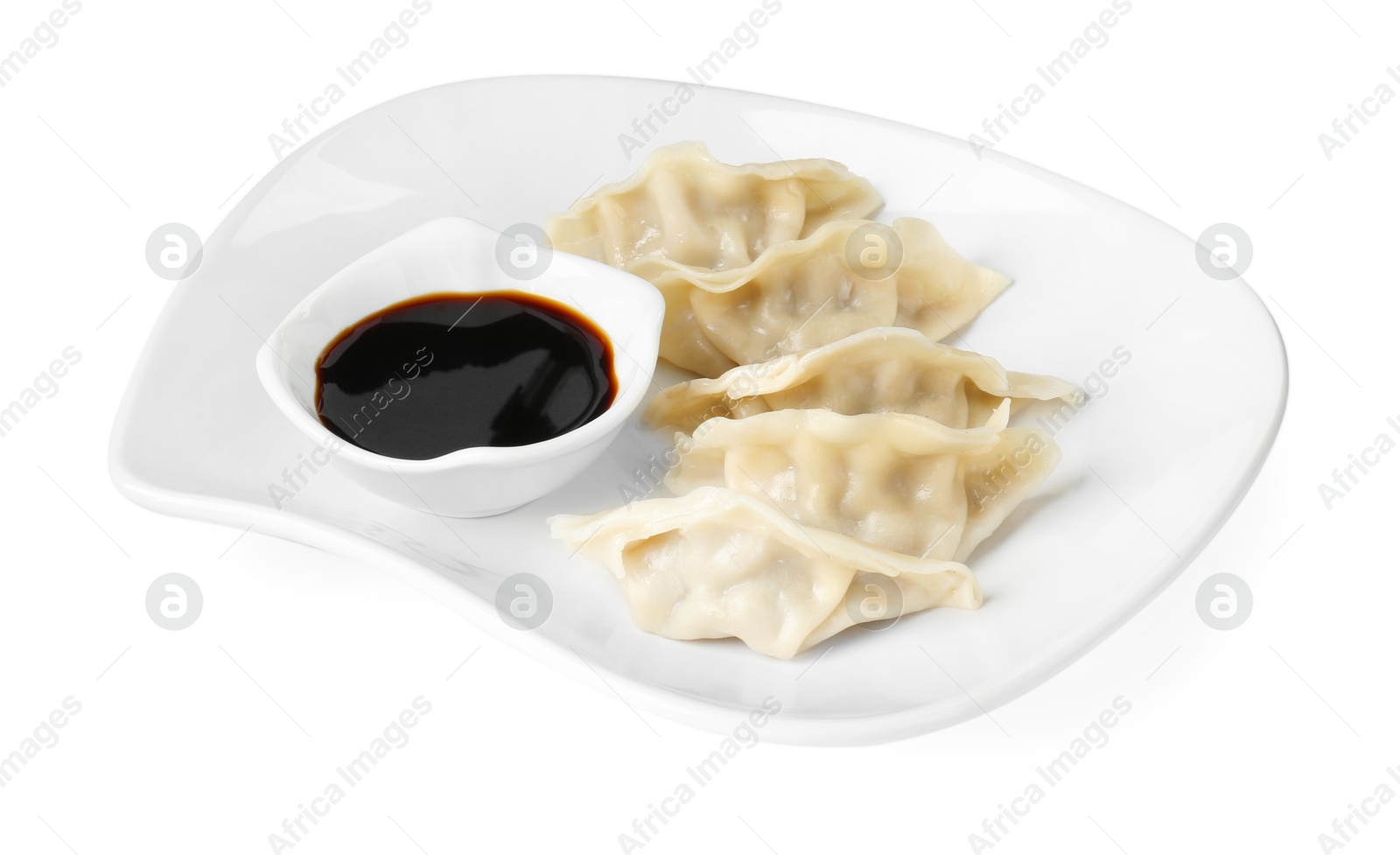 Photo of Tasty gyoza (dumplings) and soy sauce isolated on white