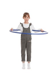 Photo of Cute little girl exercising with hula hoop on white background