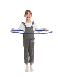 Photo of Cute little girl exercising with hula hoop on white background