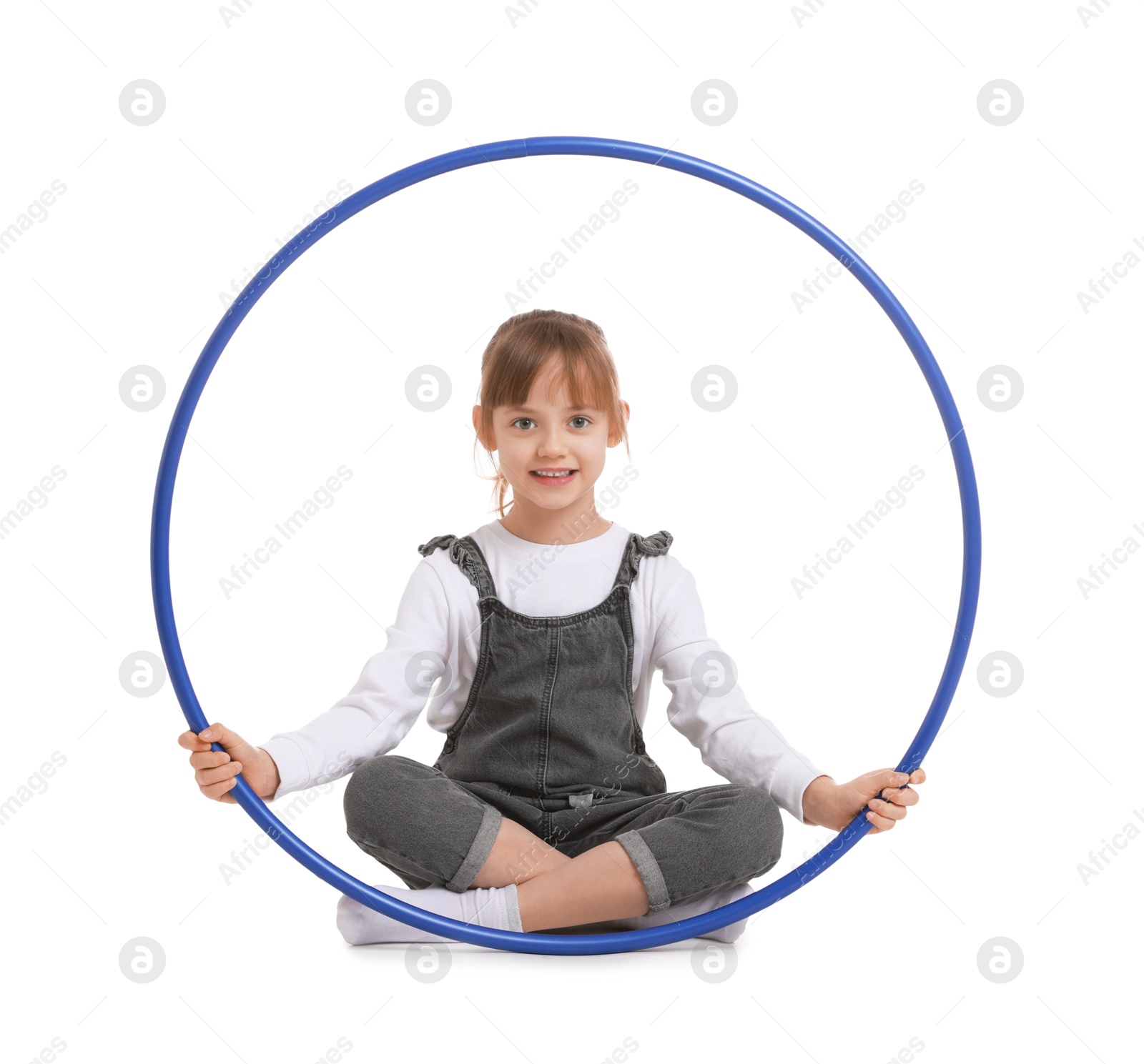 Photo of Cute little girl with hula hoop on white background