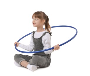 Photo of Cute little girl with hula hoop on white background