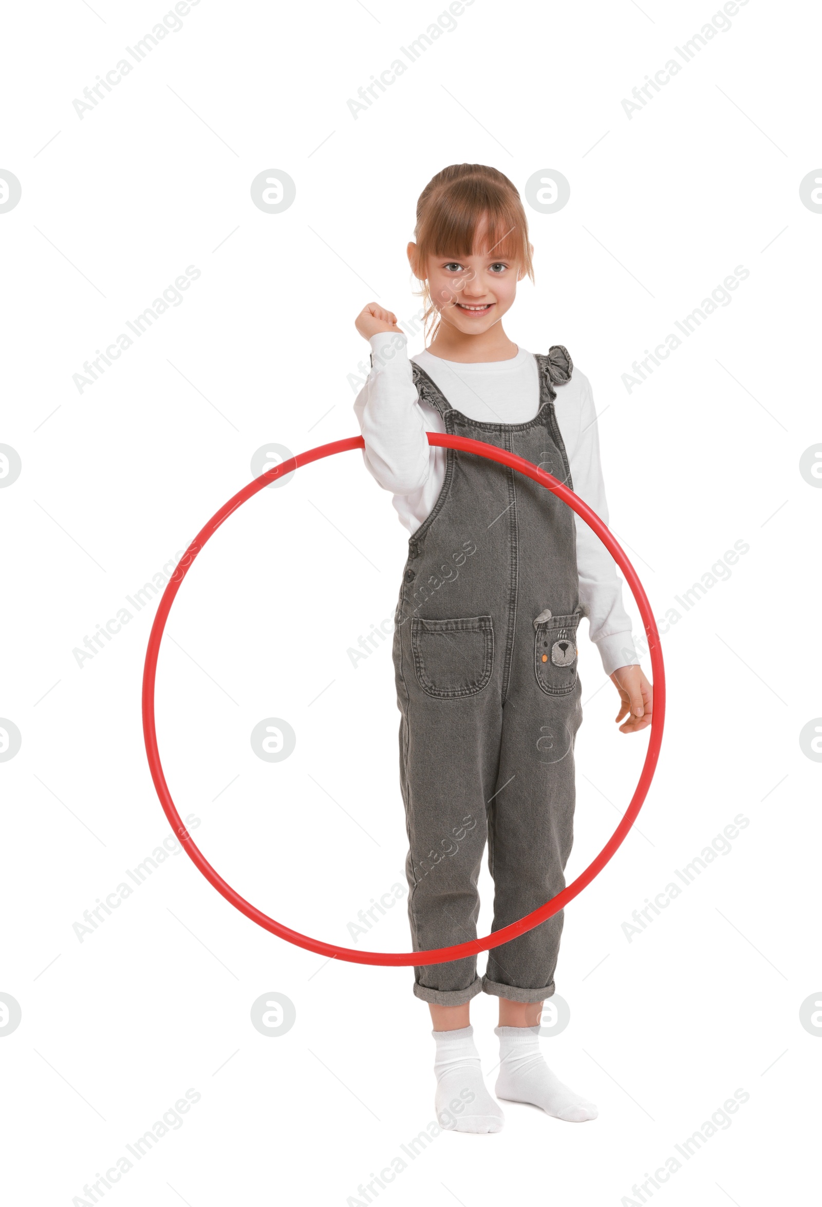 Photo of Cute little girl with hula hoop on white background