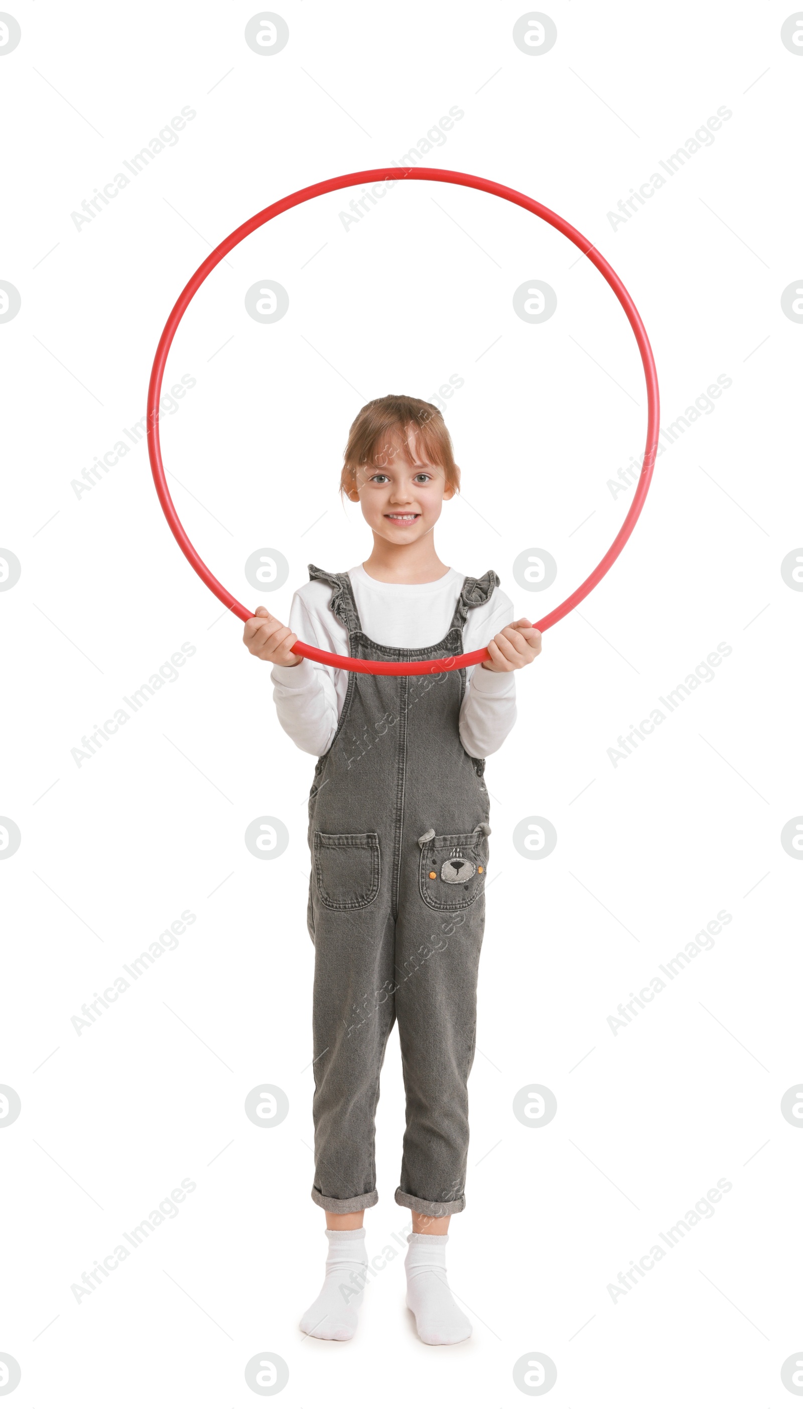 Photo of Cute little girl with hula hoop on white background