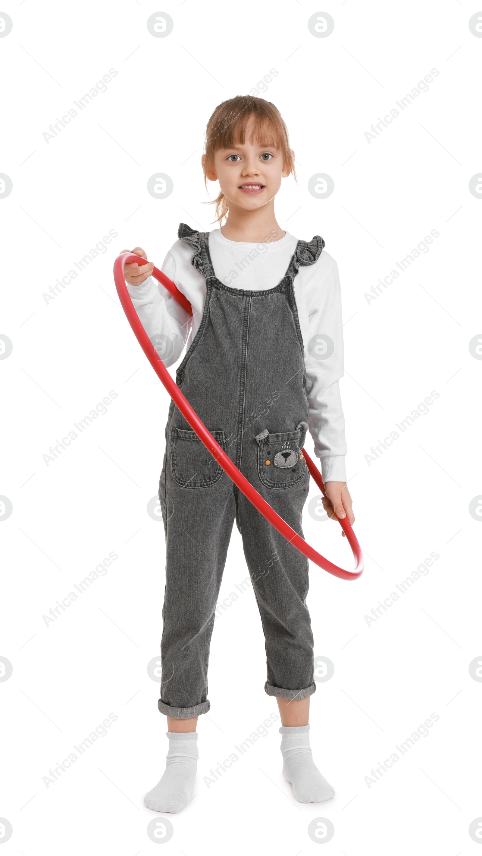 Photo of Cute little girl with hula hoop on white background