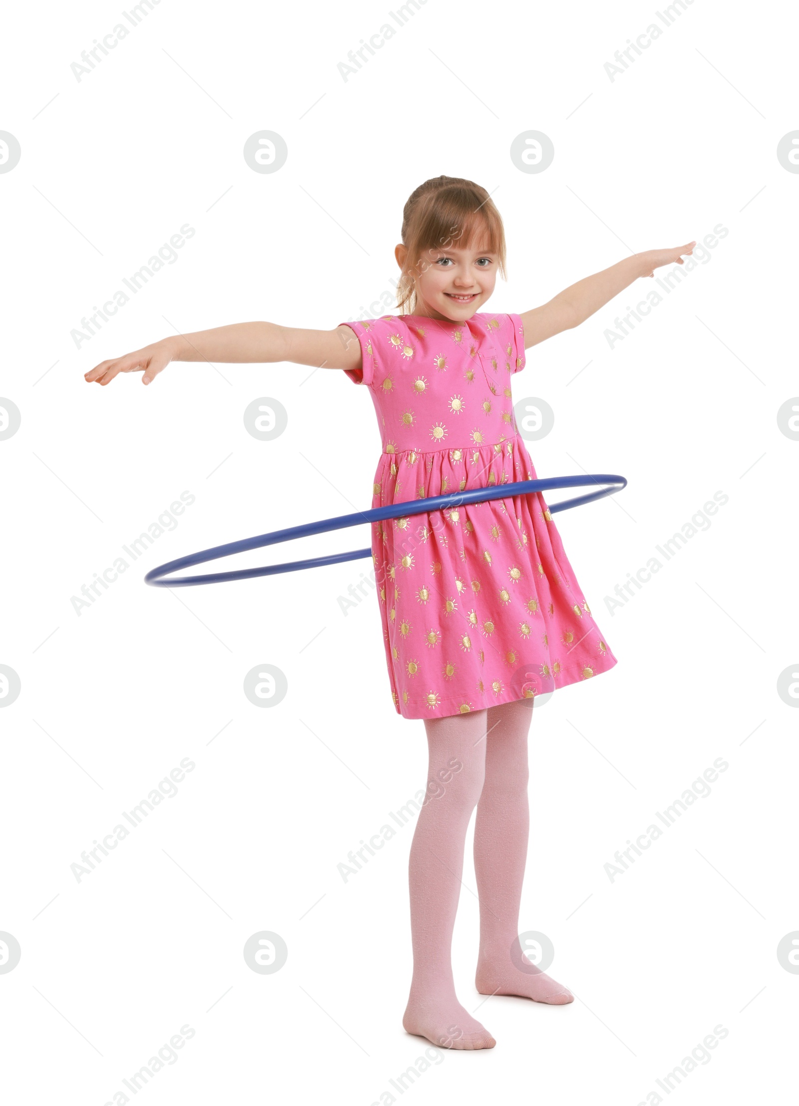 Photo of Cute little girl exercising with hula hoop on white background