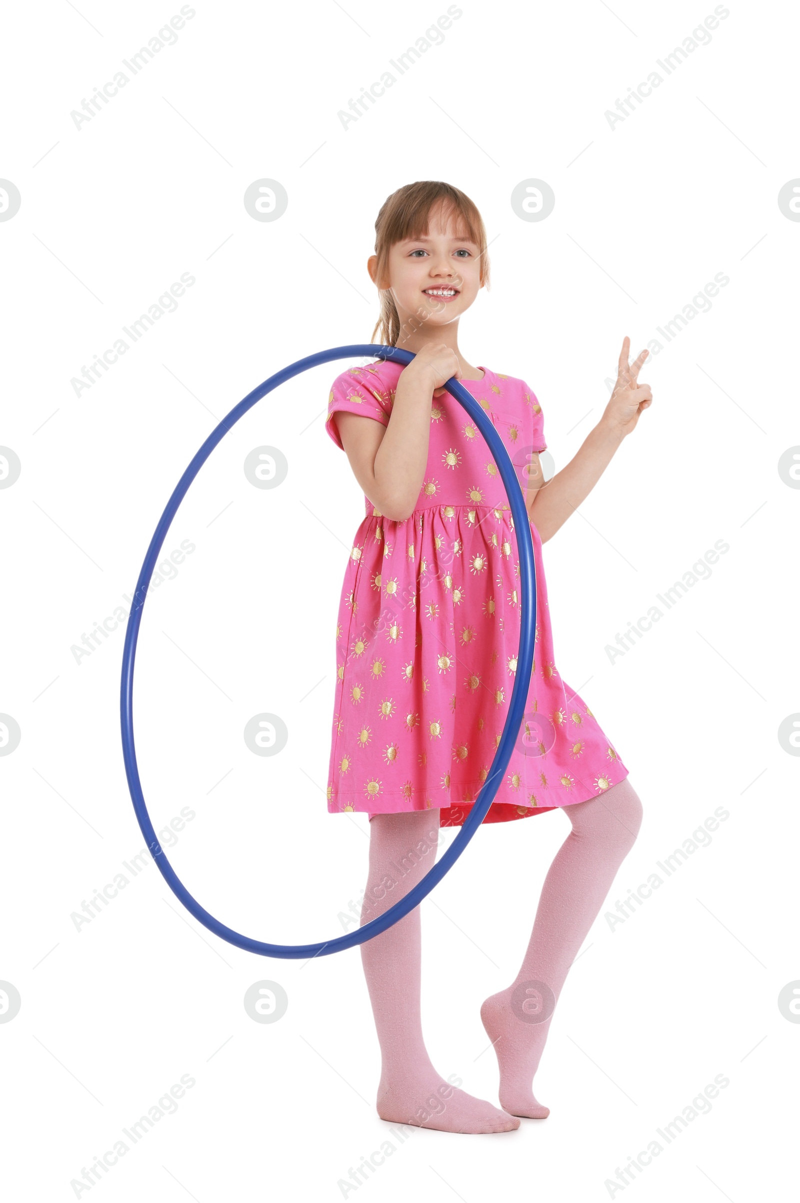 Photo of Cute little girl with hula hoop showing V-sign on white background