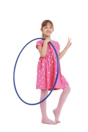 Photo of Cute little girl with hula hoop showing V-sign on white background