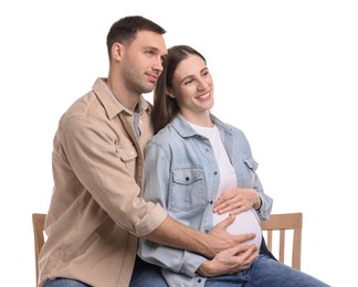 Pregnant woman and her husband on white background