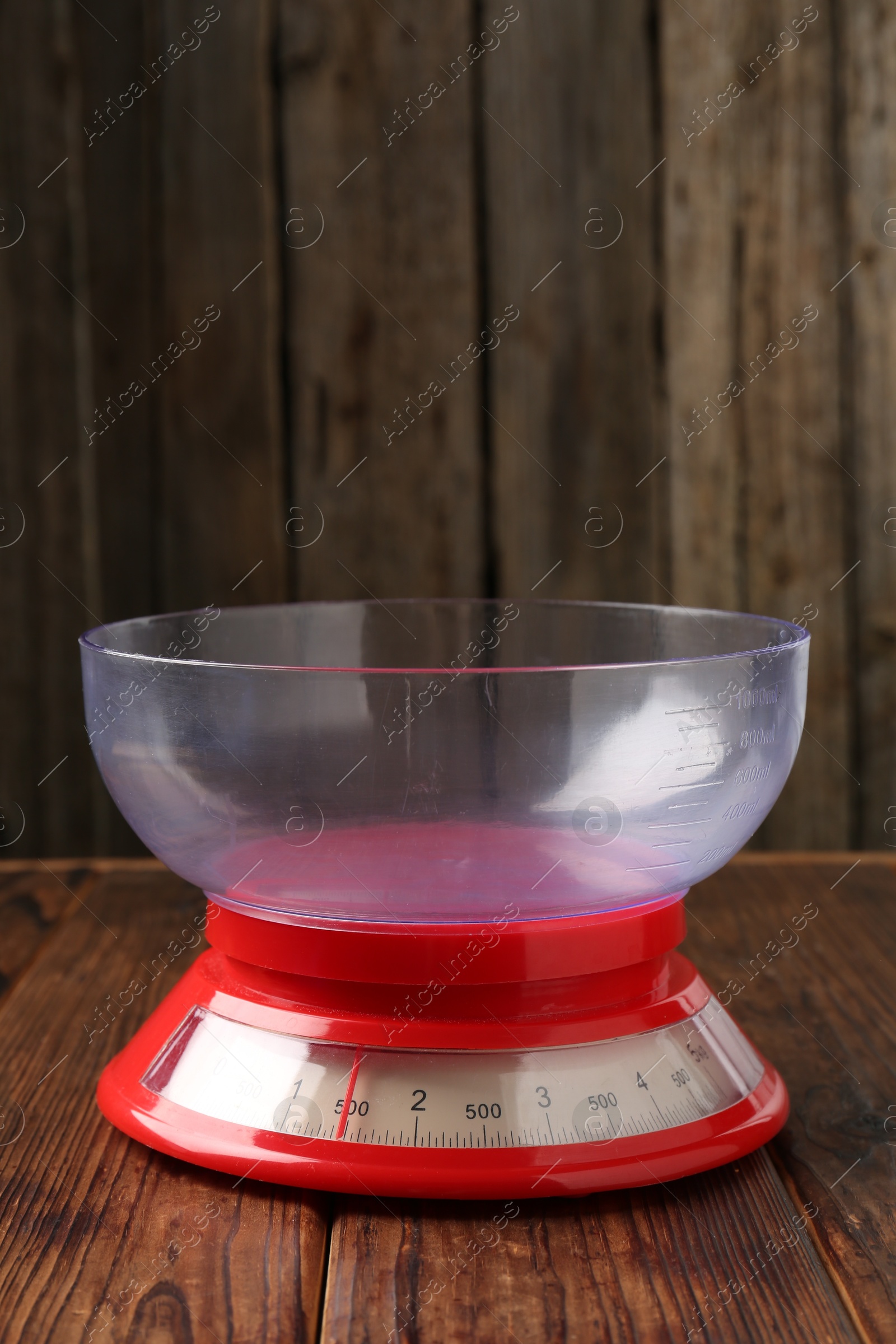 Photo of One empty kitchen scale on wooden table