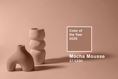 Image of Mocha mousse - color of 2025 year. Stylish vases and background in brown shade