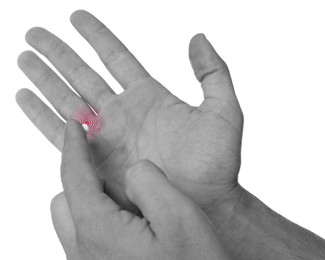 Image of Man with joint inflammation applying cream on white background, closeup. Toned in black-and-white with color area on finger