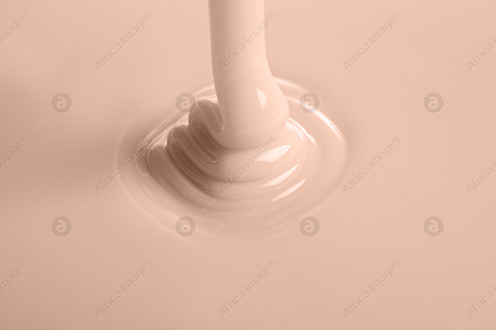 Image of Thick liquid, toned in mocha mousse shade. Color of 2025 year