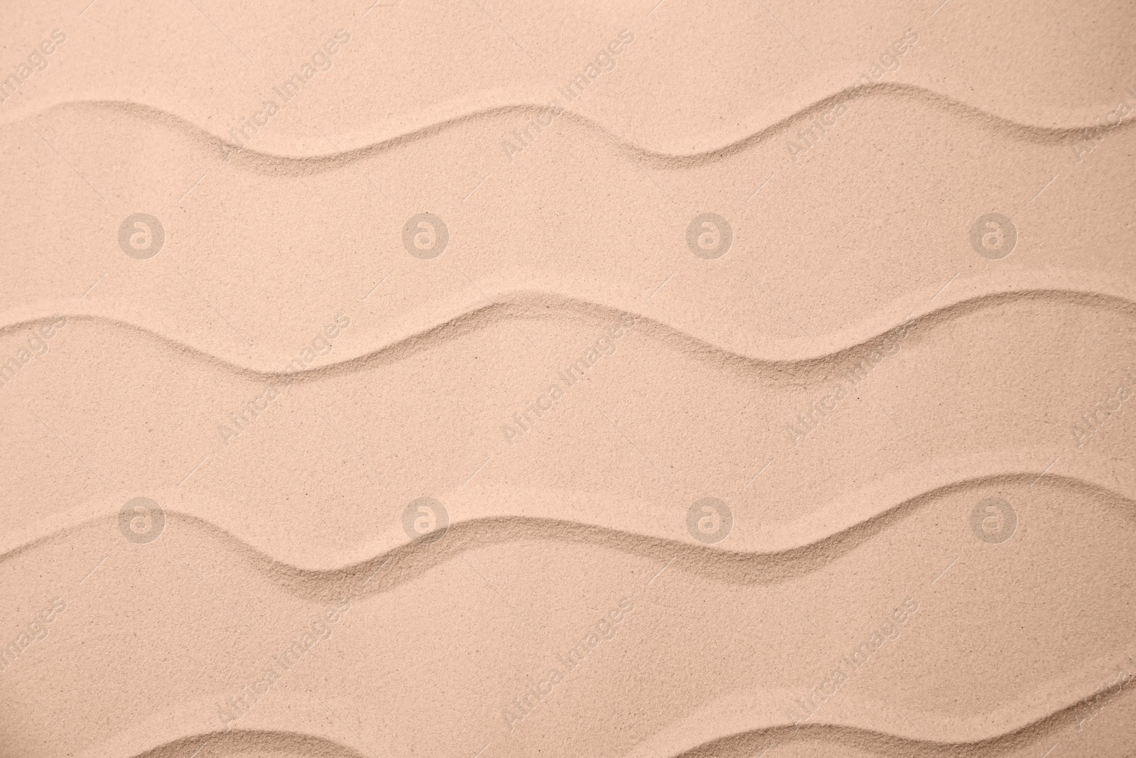 Image of Sand with pattern, top view. Mocha mousse - color of 2025 year