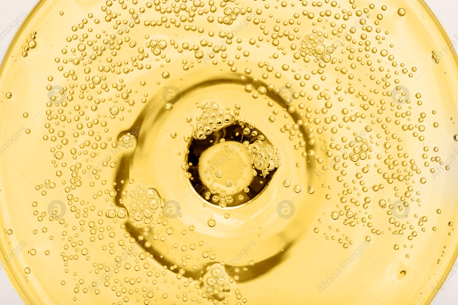 Photo of Champagne in glass as background, top view