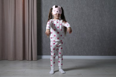 Little girl suffering from sleepwalking at home