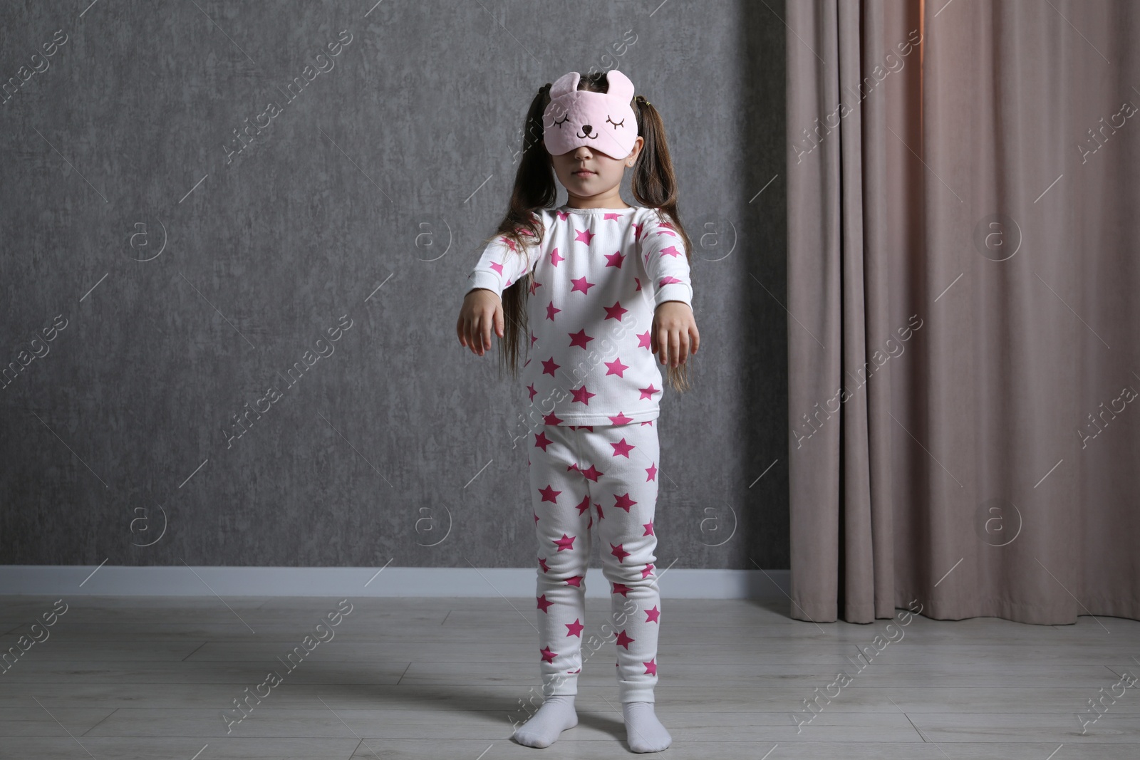 Photo of Little girl suffering from sleepwalking at home