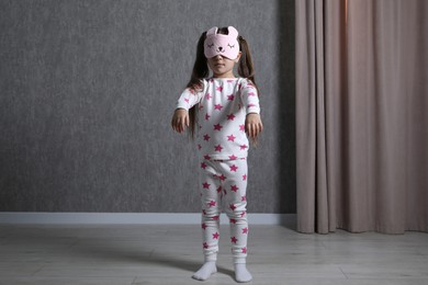 Photo of Little girl suffering from sleepwalking at home