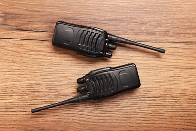 Photo of Walkie talkies on wooden table, top view