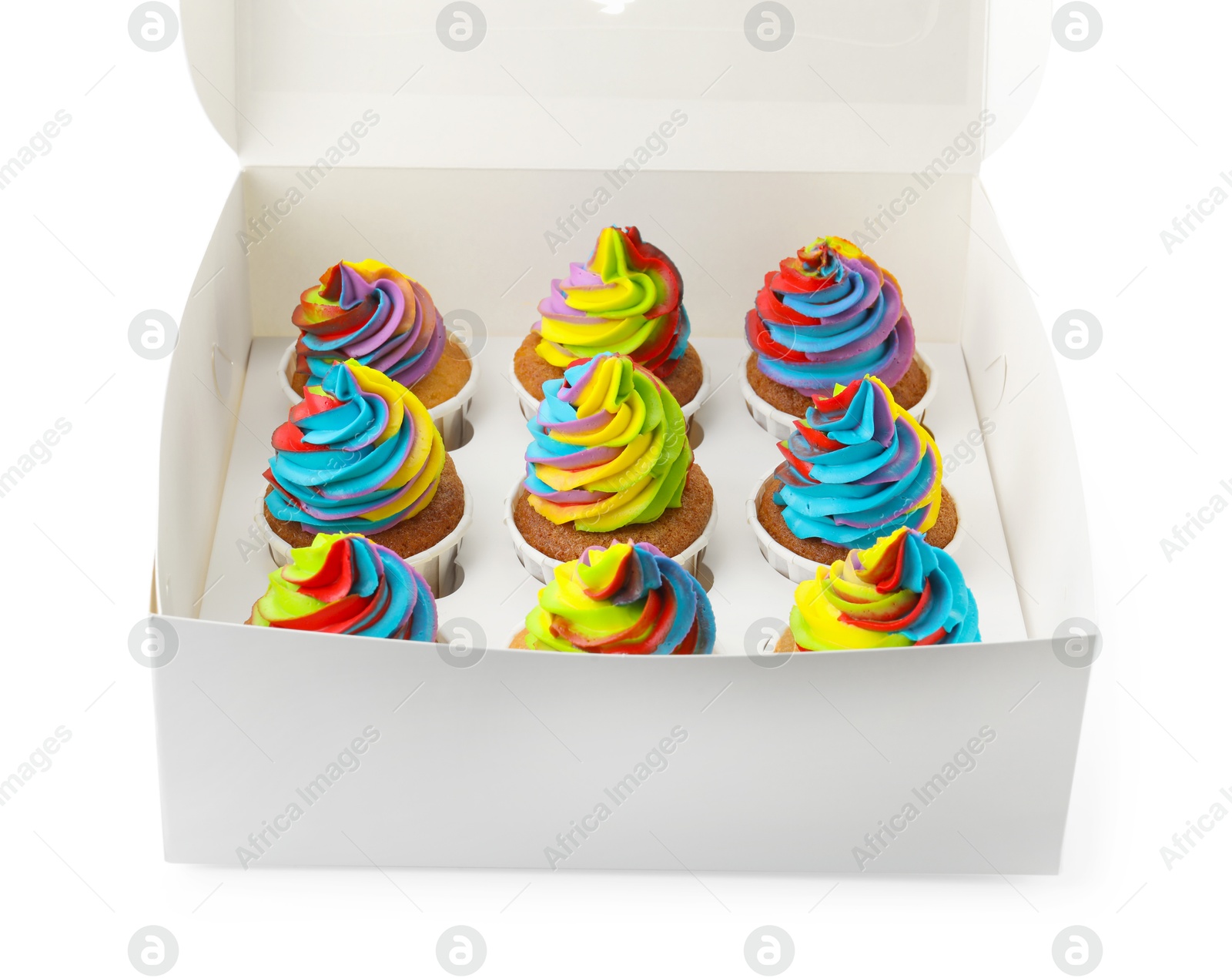 Photo of Tasty cupcakes with colorful cream in box isolated on white