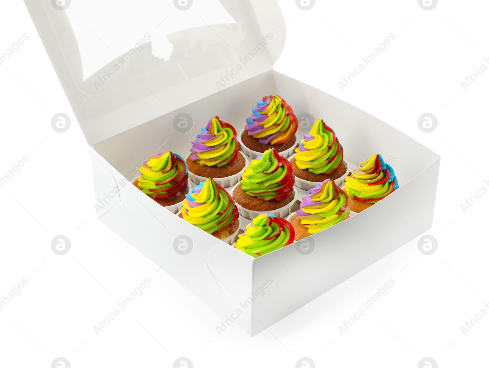 Photo of Tasty cupcakes with colorful cream in box isolated on white