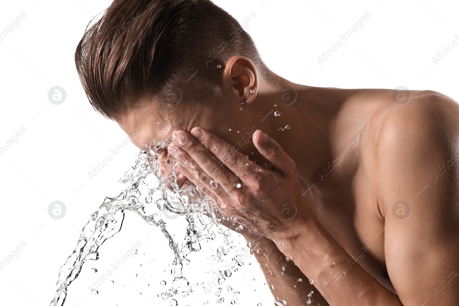 Photo of Man washing his face on white background