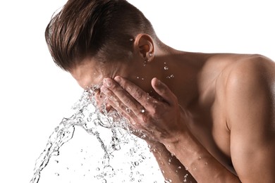 Photo of Man washing his face on white background