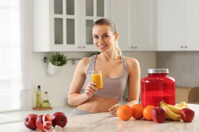 Weight loss. Happy woman with tasty shake at white marble table in kitchen