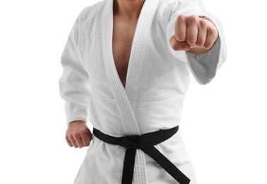 Photo of Man in uniform practicing karate on white background, closeup