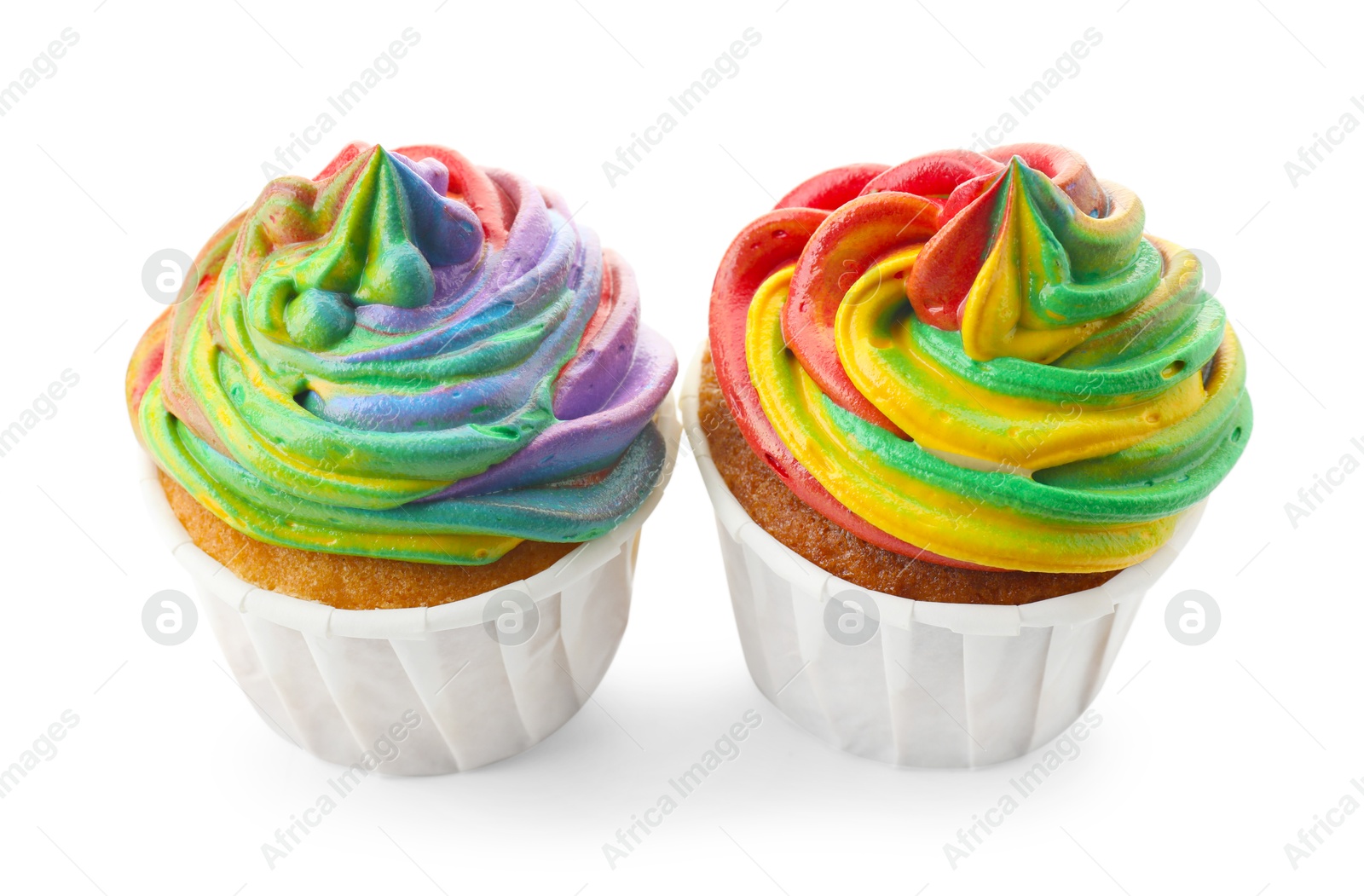 Photo of Delicious cupcakes with colorful cream isolated on white