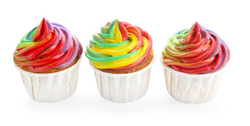 Photo of Delicious cupcakes with colorful cream isolated on white