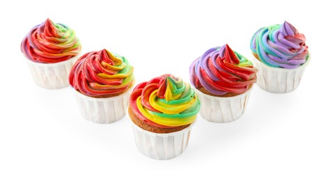 Photo of Delicious cupcakes with colorful cream isolated on white