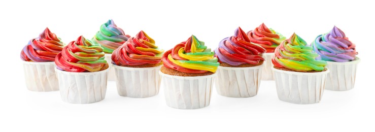 Photo of Delicious cupcakes with colorful cream isolated on white