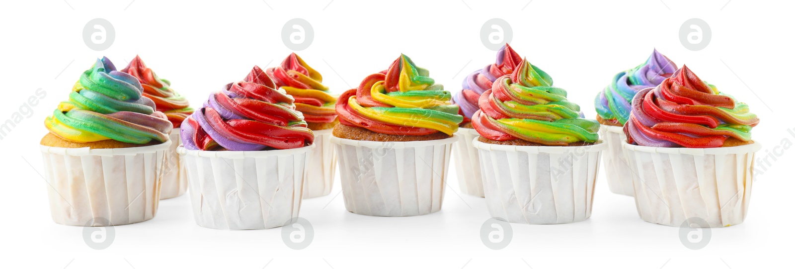 Photo of Delicious cupcakes with colorful cream isolated on white