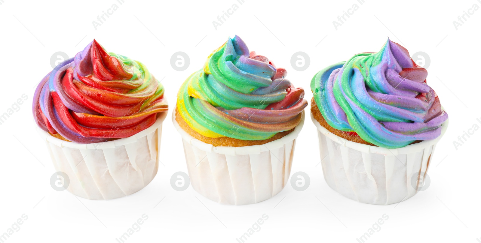 Photo of Delicious cupcakes with colorful cream isolated on white