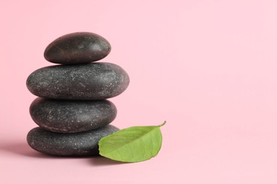 Photo of Stack of rocks on pink background, space for text. Harmony and life balance