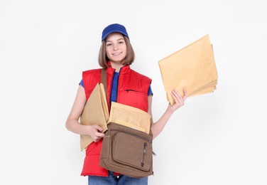 Photo of Happy postwoman with bag and envelopes on white background