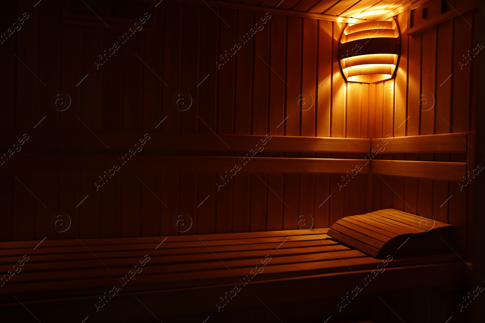 Photo of View of empty wooden sauna with bench