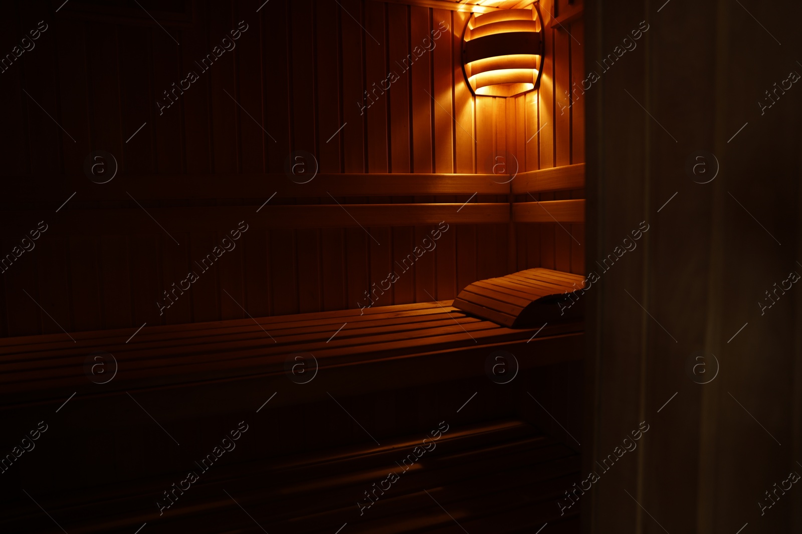 Photo of View of empty wooden sauna with bench