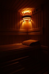 Photo of View of empty wooden sauna with bench