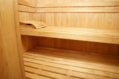 Photo of View of empty wooden sauna with bench