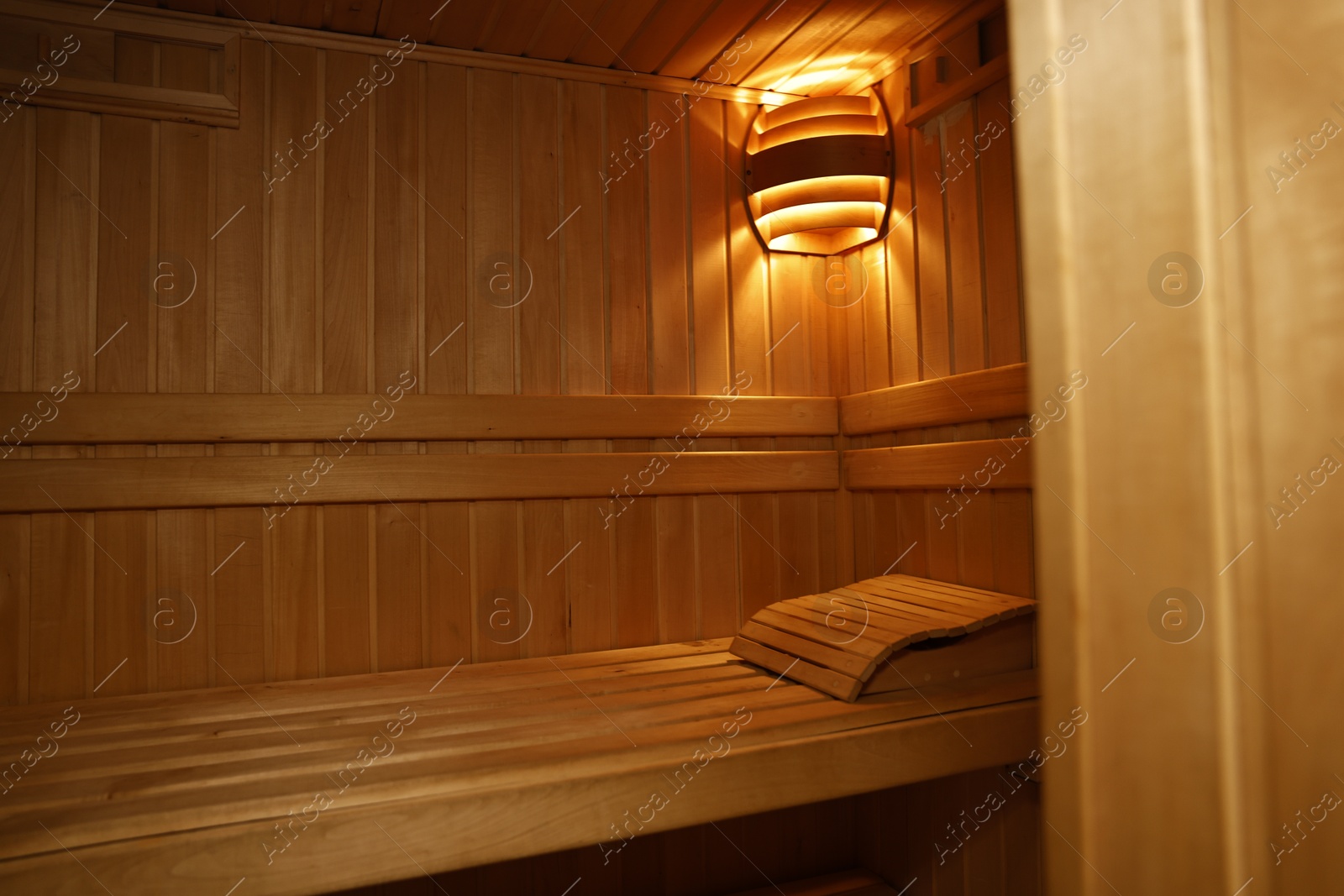 Photo of View of empty wooden sauna with bench