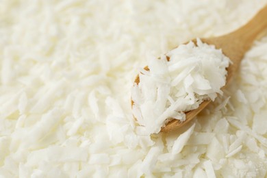 Photo of White soy wax flakes and spoon, closeup