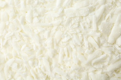 Photo of White soy wax flakes as background, closeup