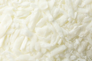 Photo of White soy wax flakes as background, closeup