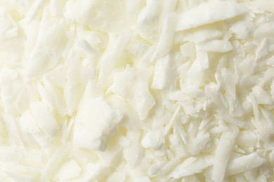 Photo of White soy wax flakes as background, closeup