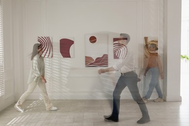 People in art gallery, motion blur effect