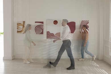 People in art gallery, motion blur effect