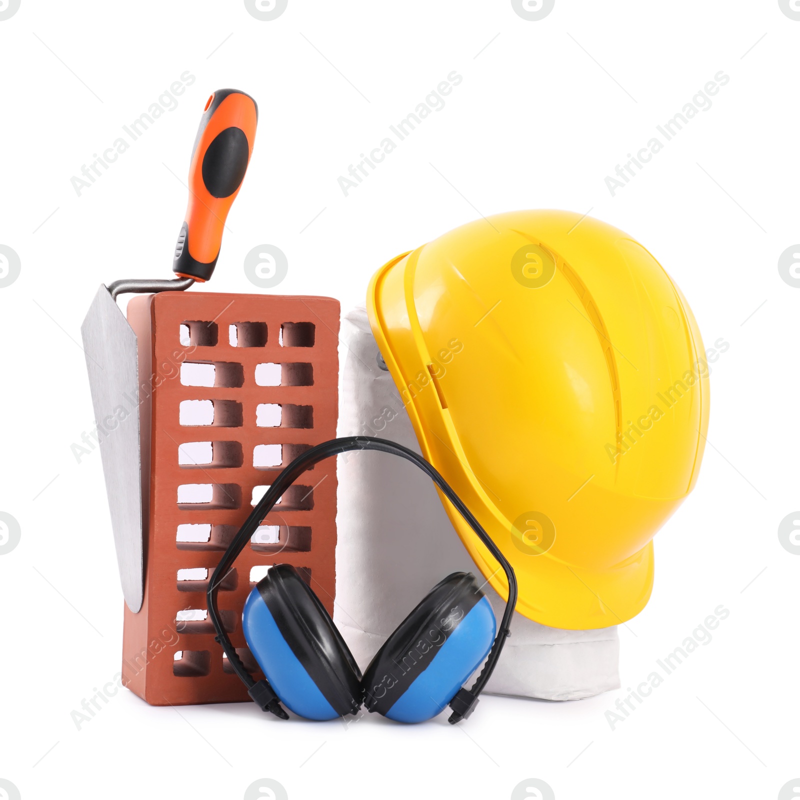 Photo of Construction materials, safety equipment and bucket trowel isolated on white